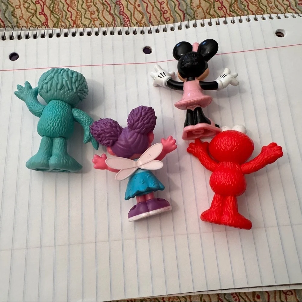 Colorful Sesame Street Neighborhood Friends and Minnie Mouse figurines